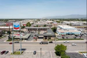 an aerial view of a town with a parking lot at Discovery Inn in Midvale