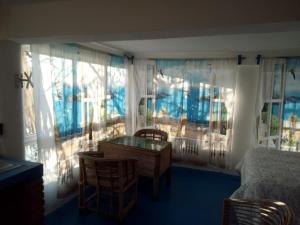 a bedroom with a desk and a bed and a window at The Blue Apartment in Puerto Ángel +11 photos