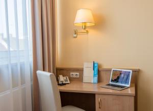 TV a/nebo společenská místnost v ubytování Hotel Royal