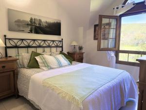 a bedroom with a large bed and a window at Casa individual - Villa Castillo 7804 in Castillo