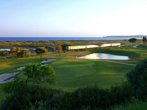a view of a golf course with a train at Palmares Beach House Hotel - Adults Only in Lagos