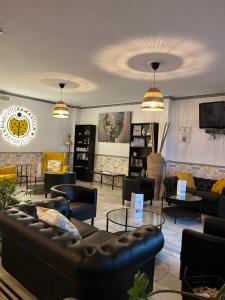 a furniture store with couches and tables in a room at Hotel Restaurante Vía Sevilla - Cádiz by MA 22 Puntos in El Cuervo