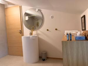 a bathroom with a sink and a mirror at Apartments Pri nas in Kobarid +239 photos