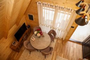 an overhead view of a living room with a table and chairs at Podostroška želja in Danilovgrad