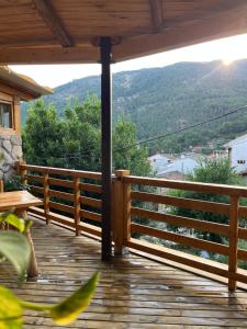 a wooden deck with a view of a mountain at La Posada de Botavara in Mijares