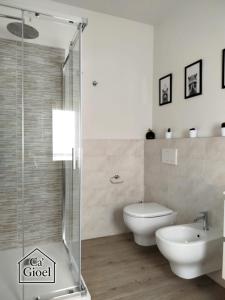 a bathroom with a toilet and a sink and a shower at Ca' Gioel in Sedrina +37 photos