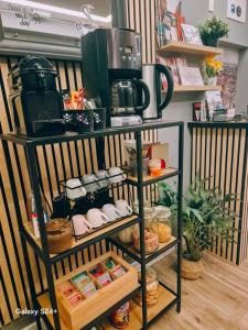 a shelf with a coffee maker on top of it at B&B Centar in Zagreb