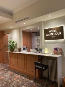 a hotel lobby with a hotel vancouver sign on the wall at Hôtel Vaubecour - Centre Lyon Ainay - Perrache in Lyon