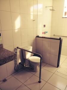 a bathroom with a toilet and a shower in it at Augustos Hotel in Santo Antônio de Jesus +28 photos