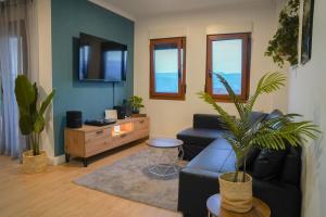 a living room with a couch and a table at CASAMONTl in Sanet y Negrals