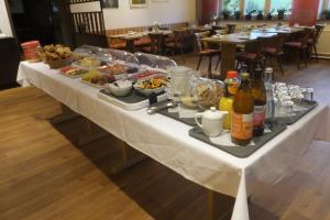 a buffet table with food and drinks on it at Gestütsgasthof Marbach in Marbach