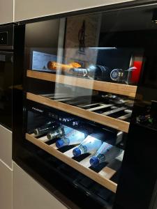 a display of wine bottles in a microwave oven at Sunset Loft in Lubin