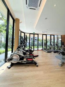 a gym with treadmills and ellipticals in a building at Dcondo reef artificial pavement Prime location in Kathu
