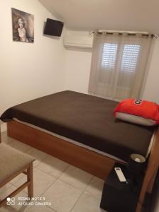 a bedroom with a bed in a room with a window at villa Montecristo in Cervione +16 photos