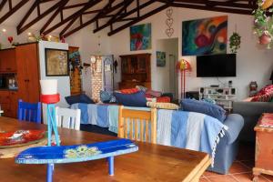 a living room with blue couches and a table at The Wilderness Way in Wilderness