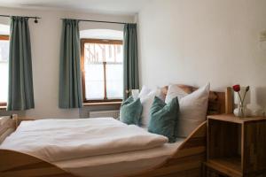 Ein Bett oder Betten in einem Zimmer der Unterkunft Brunnhuberhof