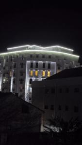 a building with lights on top of it at night at Ceca & Dimi 2 in Gevgelija