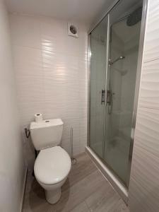 a bathroom with a toilet and a glass shower at CASA TULUM in Cognac +26 photos