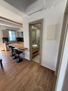 a kitchen with a table and chairs in a room at Aristeidis villas in Foiníkion +85 photos