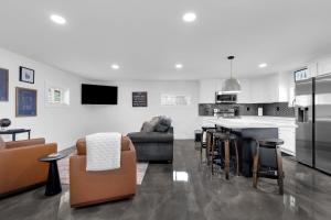 a kitchen and living room with a couch and a table at Lounges at Lynchburg in Lynchburg