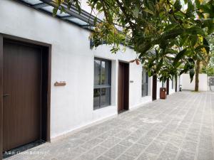 a row of doors on the side of a building at Cloud 9 Resort Hotel in Yangchang