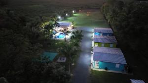 an overhead view of a house with a pool at night at Cabin Retreat for Group with Pool in Cabo Rojo