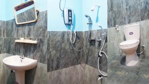 Koupelna v ubytování Kassapa Home Stay