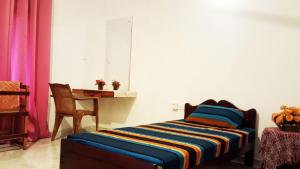 Postel nebo postele na pokoji v ubytování Kassapa Home Stay