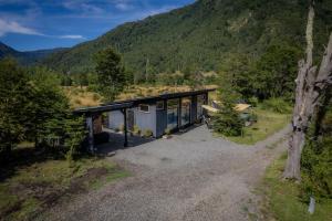 an image of a house in the mountains at Hau Lodge Malalcahuello Corralco Starlink in Malalcahuello
