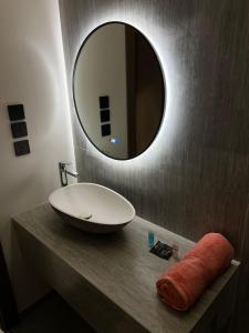 a bathroom with a sink and a mirror on a counter at محمد هوم in Al Hofuf +134 photos