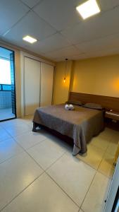 a bedroom with a bed with two towels on it at Jam flats beira mar Olinda in Olinda +14 photos