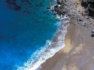 an aerial view of a beach and the ocean at Cas Ferrer Nou Hotelet in Alcudia