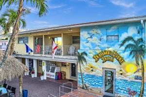 a building with a mural on the side of it at Hollywood Broadwalk Oceanside Hotel in Hollywood