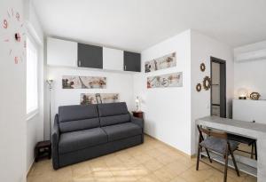 a living room with a couch and a table at Bella Vita Stays Cozy in Sondrio