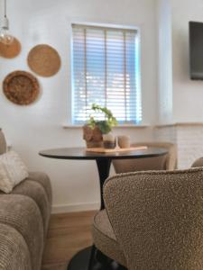 a living room with a table and two chairs at West 7 in Zandvoort