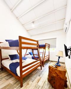 a bedroom with two bunk beds in a room at Venecia Yatch Club in San Luis La Herradura +17 photos