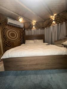 a bedroom with a large bed in a tent at luule in Al Ain
