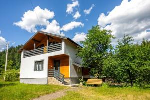 a house in a field with a sky at Шале in Krivopolʼye
