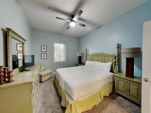 a bedroom with a bed and a ceiling fan at Seagrove Highlands #2104 in Santa Rosa Beach +12 photos