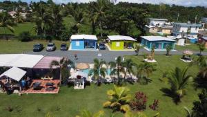 an aerial view of a house with a yard at Cozy 2BR Cabin with Pool in Cabo Rojo in Cabo Rojo
