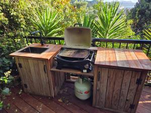 a grill sitting on top of a wooden table at The Landing - Picton in Picton +32 photos