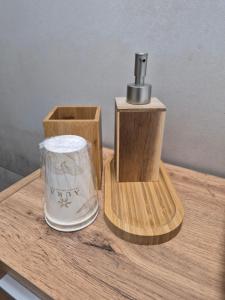 a table with a dispenser on top at Hibiscus Affittacamere - rooms&more in Stanghella