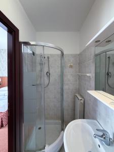 a bathroom with a shower and a sink at Fell Hotel in Susa +9 photos