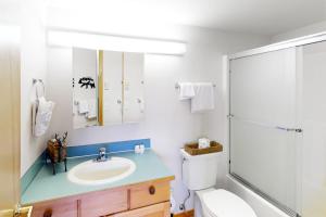 a bathroom with a sink and a shower at Lake Sutherland Retreat in Port Angeles +27 photos