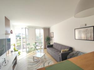 a living room with a couch and a table at Villa Arco in Vila Flor