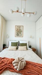 a room with a bed with a towel on it at Apartament Moje Moderato II w Starogardzie Gdańskim in Starogard Gdański