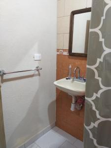 a bathroom with a sink and a mirror at Casa Verano in Guanajuato