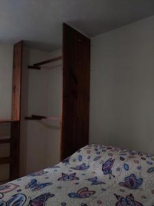 a bedroom with a bed and a dresser in a room at Casa Verano in Guanajuato +13 photos