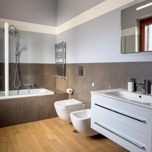 a bathroom with a tub and a toilet and a sink at Edo House Anzio - Beachfront - Fronte Mare - Affittacamere - Private Parking in Anzio