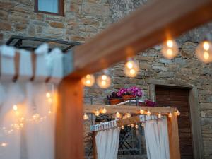 a string of lights over a stairway at a wedding at Istrian Perfect Life in Šmarje +81 photos